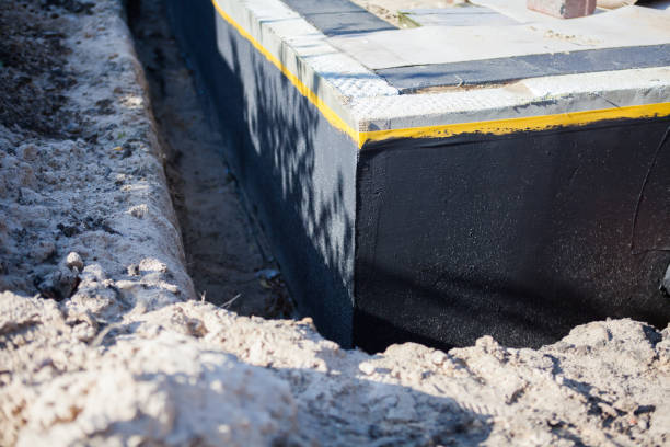 Professional Waterproofing technician working in Burlington, KS